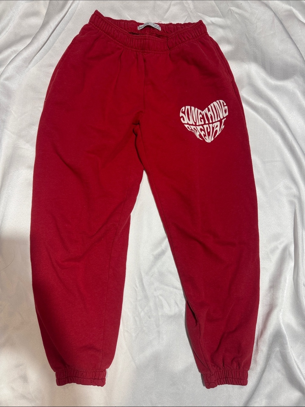 Bershka Crimson Sweatpants with White Heart Graphic